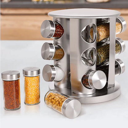 Suporte giratório inox com potes de vidro contendo especiarias coloridas para cozinha