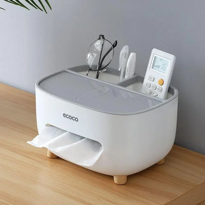 Dispenser branco porta lenço e papel com compartimentos multifuncionais organizando controles e óculos