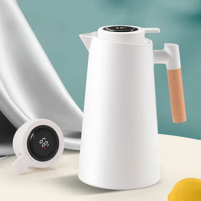 Garrafa térmica branca com termômetro digital no topo e alça de madeira, item moderno para café e chá