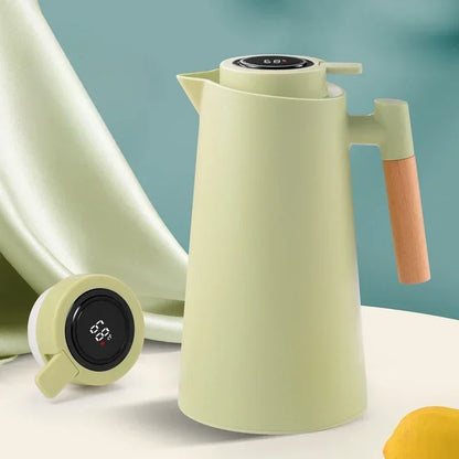 Garrafa térmica verde com alça de madeira e termômetro digital para café e chá